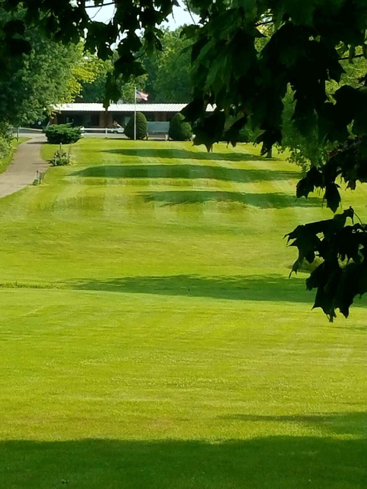 View of clubhouse from manicured greens
